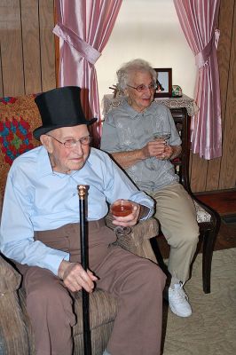 Citizen Cane
Ninety-eight-year-old Chester "Chet" Rollins of Rochester, seen here donning a top hat next to his wife Marjorie, recently received the Boston Post cane from the town Selectmen during a presentation ceremony at his home on Friday, December 19. (Photo by Kenneth J. Souza).
