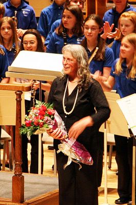 Hannah's Moment
The thrill of a lifetime ... Sippican School Band Director Hannah Moore receives a bouquet of roses after conducting the school band at Symphony Hall in Boston on May 3. The band earned the honor of performing in Boston after winning a gold medal at the MICCA (Massachusetts Instrumental and Choral Conductors Association) competition, joining their counterparts from both Mattapoisett and ORR who have also had the honor of playing at the venue. (Photo courtesy of Jane McCarthy).
