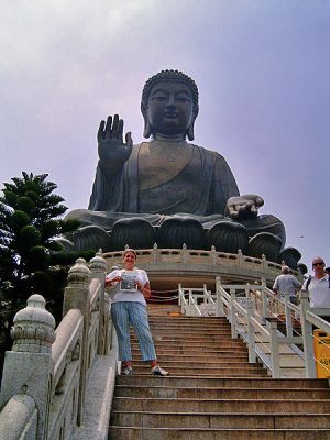 Beneath the Buddha
Wareham resident Stephanie Caron, who grew up in Marion, poses in front of the largest outdoor sitting Buddha in the world located just outside Hong Kong with a copy of The Wanderer during a recent trip.

