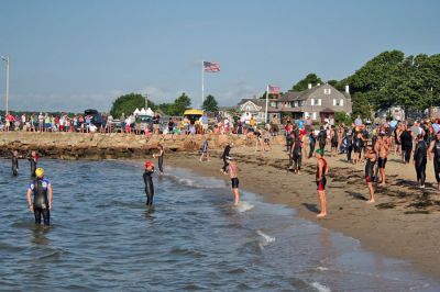 Triple Threat
The 2008 running of the Mattapoisett Lions Club Triathlon was held at the Mattapoisett Town Beach on Sunday morning, July 13, beginning at 8:00 am. This year 173 participants attempted the triple event which began with a swim in Mattapoisett Harbor, a bike ride into the town village, and a marathon back to the Town Beach. (Photo by Robert Chiarito).
