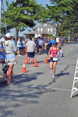Triple Threat
Kimberly Shattuck of Bridgewater was the first female contender to cross the finish line in the 2008 Mattapoisett Lions Club Triathlon on Sunday, July 13, finishing ninth overall. (Photo by Robert Chiarito).
