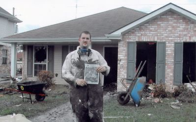 Rochester Restorer
William Maxwell of Rochester poses with a copy of The Wanderer outside a house he helped to restore in the wake of the disaster in Chalmette, Louisiana, just outside of New Orleans. Like many others, Mr. Maxwell volunteered to help with crucial relief efforts down south.
