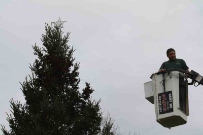Mattapoisett Town Tree Gets Lights
Todd Pacheco continues a tradition of decorating the town Christmas tree. After his father, Kenny Pacheco, started the tradition of decorating the town tree with the Village Signs bucket truck several years ago, his son Todd is keeping the tradition alive on November 29, 2011. The tree will be ready for the Holiday in the Park on December 3 at 4:00 pm for a lighting. Photo by Anne Kakley.

