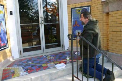 Masonry at the Pythagorean Lodge
Lodge member Paul Ciccotelli takes advantage of a pleasant afternoon on December 2, 2011, to touch up the masonry on the steps of the Spring Street Pythagorean Lodge building. The mosaic took one and a half years to complete, said Mr. Ciccotelli. Photo by Anne Kakley.
