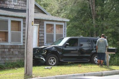 SUV Drives into Route 6 House
An accident landed a black SUV into the house at 130 Fairhaven Road, Mattapoisett, on September 9, 2011.
