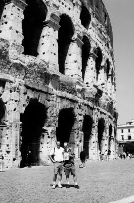 01-17-02
Richard and Shane Wilhelmsen of Mattapoisett pose with a copy of The Wanderer just outside the Coliseum in Rome during a recent family trip to Rome, the Greek Isles, and Athens. (Photo courtesy of Rebecca Wilhelmsen). 1/17/02 edition
