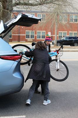 Bikes for All
Volunteer Jenn Wong, background, helps Mattapoisett resident Kathleen Upton unload the second of her two bicycle donations during Saturday’s “Bikes for All” initiative run by the Friends of the Mattapoisett Rail Trail at the Mattapoisett Congregational Church. Since the Covid pandemic in 2021, the group has collected over 400 bikes and distributed approximately 200 of them, using the rest for parts. Photo by Mick Colageo. March 13, 2025 edition
