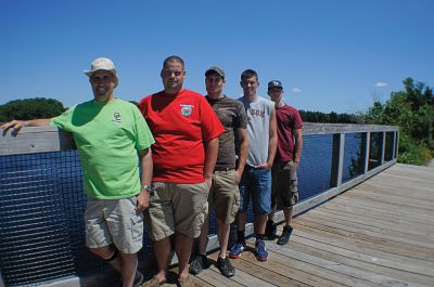 Bikeway-Challenge-2
From Left to Right; Stu Norton, Doug Sims, Nick Antone, Mike Hamel and Jacob Pacheco. Mr. Norton and members of Old Colony’s class of 2011 on the bike path bridge they built. Photo by Felix Perez.
