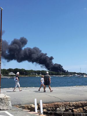 Mattapoisett Boatyard Fire
Smoke rose over Mattapoisett Harbor on August 19 after a boat caught fire during the replacement of a gasoline tank. An explosion followed by a raging fire leveled Mattapoisett Boatyard and destroyed the 14 boats and 47 vehicles on site. Members of the Kaiser family who own the business and members of the McLean family who founded the business surveyed the ruins on the weekend and vow to rebuild. Photos by Marilou Newell and courtesy of Mattapoisett Police and Fire departments and Kathleen Costello
