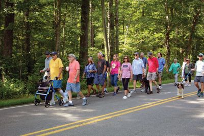 7,000th Mile
Brad Hathaway, 92, walked his 27,000th mile on Saturday, surrounded by a gathering of family and friends while promoting the Priscilla Hathaway Art Scholarship in memory of his late wife. Photos by Mick Colageo
