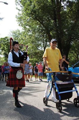 7,000th Mile
Brad Hathaway, 92, walked his 27,000th mile on Saturday, surrounded by a gathering of family and friends while promoting the Priscilla Hathaway Art Scholarship in memory of his late wife. Photos by Mick Colageo
