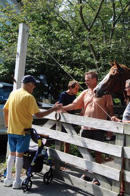 7,000th Mile
Brad Hathaway, 92, walked his 27,000th mile on Saturday, surrounded by a gathering of family and friends while promoting the Priscilla Hathaway Art Scholarship in memory of his late wife. Photos by Mick Colageo
