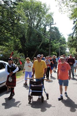 7,000th Mile
Brad Hathaway, 92, walked his 27,000th mile on Saturday, surrounded by a gathering of family and friends while promoting the Priscilla Hathaway Art Scholarship in memory of his late wife. Photos by Mick Colageo
