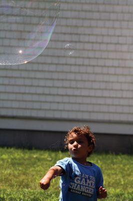 Keeping it cool
Kids gathered outside the Joseph H. Plumb Memorial Library on Friday, July 21, chilling in the shade drenched in bubble stuff with Vinny the Bubble Guy. Photos by Jean Perry
