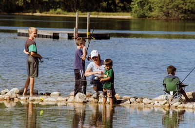 Gine Fishing
Rochester Scout Pack 30 had a fishing day at Five Mile Pond at Camp Cachelot in Myles Standish State Forest on September 27. The Cub Scouts were being trained in the art of fishing, tying knots for their hooks, as well as baiting a hook. Joshua Ernstzen, 7, (middle right) was the first Cub Scout to catch a fish. Photos by Denzil Ernstzen
