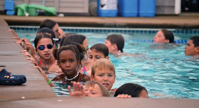 Happy Campers 
What's happening on a Tuesday morning at Camp Massasoit? It’s easier to ask what's not going on – swimming, boating, archery, crafts, exploring, wall climbing, ball playing, and that's all before they even break for lunch. Photos by Jonathan Comey
