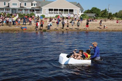 Cardboard Boats
Grade 7 students at Old Rochester Regional Junior High School took to the beach on Tuesday morning for a field day at the Mattapoisett YMCA that featured a cardboard boat race. The boats were designed entirely of cardboard and duct tape. The SCOPE program also included making tie-dye T-shirts. Photos by Mick Colageo
