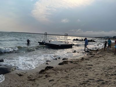 Crescent Beach
Last Saturday, the diving raft at Crescent Beach, Mattapoisett broke loose. Several (mostly older) residents held it from beaching in rough waters for approximately an hour while waiting for help from Mattapoisett Boatyard and while trying to reach a young volunteer who coordinates all things related to the raft. Photos courtesy Jennifer M. Capobianco
