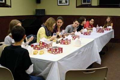 Cupcake Decorating
Several local children took park in a holiday cupcake decorating activity at the Mattapoisett Free Public Library on Wednesday, December 5.  ORR senior Mattie Boyle was invited by the youth group S.K.W.A.R. (Strange Kids Who Actually Read) to lead the group with tips and hints.  Photo by Eric Tripoli.
