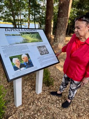 DePina Landing
Members of the public and the DePina family gather around a new commemorative plaque at the rededication ceremony for DePina Landing on Wednesday, August 14. Photo by Robert Pina
