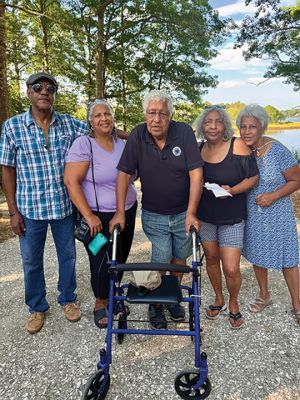DePina Landing
Members of the public and the DePina family gather around a new commemorative plaque at the rededication ceremony for DePina Landing on Wednesday, August 14. Photo by Robert Pina
