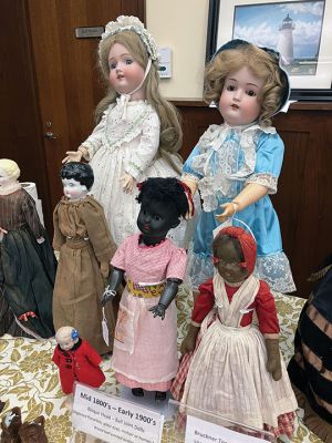 Dolls
Dolls are said to have existed since the Paleolithic Era according to Jenny McIntyre, who on August 6 gave a presentation at the Mattapoisett Free Public Library. The dolls on display spanned from the 1800s to the 1960s, looking out at the audience as McIntyre explained the composition of dolls through the ages. The display showed how dolls reflect the breath of human activity from fancy dress to modest burlap coverings and all walks of life. Photos by Marilou Newell
