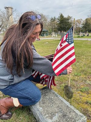 Veteran's Flags
Displaying flags at veterans’ graves. Photo by Robert Pina
