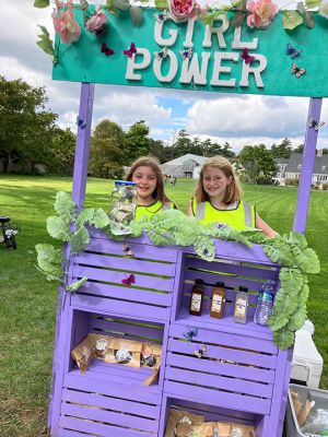 Girl Power
Friends Hailey Costa and Stella Waterman sold sweet treats and drinks at Washburn Park on October 5 with their “Girl Power” roadside stand. Photo by Marilou Newell
