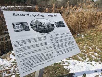 Tripp Mill
There’s a new historical plaque situated at the site of the former Tripp Mill. Located on the west branch of the Mattapoisett River off Acushnet Road, Tripp Mill was owned and operated for decades by members of the Tinkham family. A stone spillway remains at the site. The over 20-acre Tinkham Pond fed by the Mattapoisett River along with other contiguous parcels are now part of conservation lands held in part by the Buzzards Bay Coalition and the U.S Fish and Wildlife Department. 
