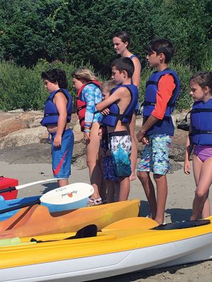 Kayak Clinic
August 9 and 10, the Mattapoisett Land Trust in partnership with the Mattapoisett Recreation Department held two kayak clinics for children ages 8 to 12. MLT volunteers provided safety instructions, a major focus of the program. Kayak introductory instruction has been provided by the two organizations for six years. This year local photographer and author Donna Lee Tufts greeted the children at the end of the program, sharing her thoughts of the joy of kayaking and presenting each child with a copy of her b
