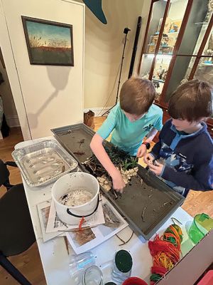 Marion Natural History Museum
After learning how to build a snake hibernaculum, a beaver lodge, and a bear den, the group tried their hand at creating miniatures for museum display. The beaver lodge was tested to see if it held water back and still kept the lodge dry inside. It was a huge success! Feel free to come in to view any of these creations during the museum’s open hours. Photo courtesy Elizabeth Leidhold.
