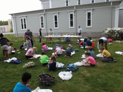 Chemistry of Tie Dye
The Marion Natural History Museum's last afterschool program of this school year featured "Chemistry of Tie Dye" with Chemist Jessica Robidoux and coordinated by Dr. William (Toby) Dills of UMass Dartmouth's Chemistry Department.  The Museum wishes to thank Ms. Robidoux, Dr. Dills, and all the many volunteers who showed up to help with the program. The students learned a little something about acids and bases as well as having fun dyeing their shirts.  Photo courtesy Elizabeth Leidhold
