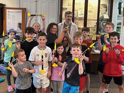 Marion Natural History Museum
Many thanks to Mike Cronin for sharing his rocketry expertise with our afterschool group. We learned about what’s needed for lift-off and propulsion, as well as how to add the “recovery wadding” and parachute to ensure the rocket doesn’t get damaged. The kids had a wonderful time counting down and watching each of the rockets launch. The museum’s upcoming programs are listed at the museum website: www.marionmuseum.org. Hope to see you soon. Photo courtesy Elizabeth Leidhold

