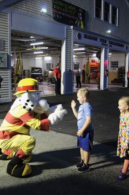 Marion Fire Department 
The Marion Fire Department held an open house on Friday evening. Older children learned how to use fire-extermination equipment, and younger ones enjoyed the bouncy house and a meeting with mascot Sparky. Photos by Mick Colageo
