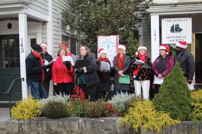 2024 Marion Christmas Stroll
The 2024 Marion Christmas Stroll took place on December 8. Pictured are Carolers outside The Sippican Historical Society (top), Mr. and Mrs. Clause riding their carriage on Front Street (left), and Santa arriving by tugboat (bottom). Photos by Sam Bishop and Mick Colageo.
