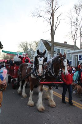 2024 Marion Christmas Stroll
The 2024 Marion Christmas Stroll took place on December 8. Pictured are Carolers outside The Sippican Historical Society (top), Mr. and Mrs. Clause riding their carriage on Front Street (left), and Santa arriving by tugboat (bottom). Photos by Sam Bishop and Mick Colageo.
