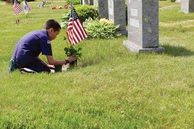 Memorial Day
Marion Boy Scouts, town employees, and volunteers spend Saturday morning planting flowers on veteran’s graves at Evergreen Cemetery, one of the ways Marion honors its veterans every year come Memorial Day. Photos by Robert Pina
