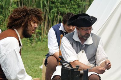 Living History 
It looked like July 8, 1776 at Silvershell Beach in Marion this past Saturday. Folks from the Fairhaven Village Militia and Wareham Militia Group in conjunction with Marion Recreation and the Marion Cultural Council took spectators back in time to Colonial Massachusetts during a weekend-long encampment at the beach. Participants in olde-tyme apparel demonstrated what life was like in the 1770s during the Revolutionary War through demonstrations of drilling, cooking, and flintlock musket use. Photos by Jean 
