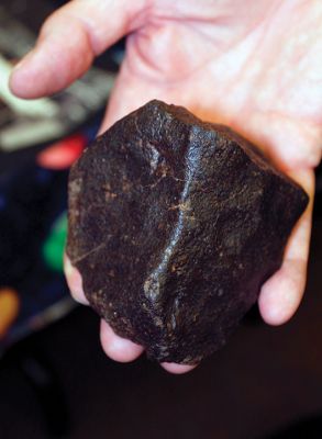 Telescope Program
Jim Zebrowski, President of the Aldrich Astronomical Society, holds a meteorite from North West Africa. Photo by Deina Zartman
