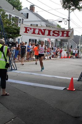 48th Annual Mattapoisett Road Race 
The 48th Annual Mattapoisett Road Race once again brought out young and old alike. Overcast skies were welcomed but the July 4th heat was tough for the runners and the cheering crowds who begged for shade. The field of runners was well over 1,000 and coming in first was Joe Farrand at 26:59. Shortly after, the first female to finish was Kim Bolick at 29:54. Before the starting gun sounded there was a moment of silence in honor of Maurice “Mudgie” Tavares who established the Mattapoisett Track Club, and the 
