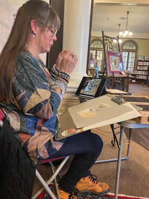 Artist Mj Manville Cloutier 
Artist Mj Manville Cloutier recently visited the Mattapoisett Free Public Library where she engaged with the community as she worked on a pet drawing. Photo by Marilou Newell
