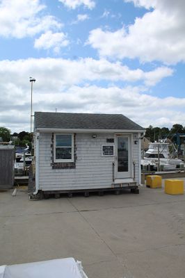 Marion Harbormaster
Construction continues on the new Maritime Center in the northeast corner of Island Wharf. Meantime, Marion’s Harbormaster Department will continue working out of the old building, albeit in a new location just down the wharf. Photos by Mick Colageo and courtesy Town of Marion
