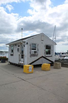 Marion Harbormaster
Construction continues on the new Maritime Center in the northeast corner of Island Wharf. Meantime, Marion’s Harbormaster Department will continue working out of the old building, albeit in a new location just down the wharf. Photos by Mick Colageo and courtesy Town of Marion
