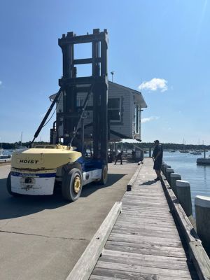 Marion Harbormaster
Construction continues on the new Maritime Center in the northeast corner of Island Wharf. Meantime, Marion’s Harbormaster Department will continue working out of the old building, albeit in a new location just down the wharf. Photos by Mick Colageo and courtesy Town of Marion
