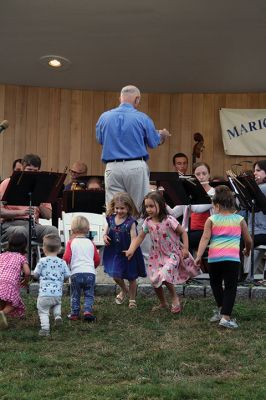 Young People’s Concert
The Marion Concert Band catered to the young ones on July 27 during its children’s-themed performance, “Young People’s Concert,” with selected songs familiar to children. Here, band conductor Tobias Monte sits onstage with the children, firing up their imaginations, and handing out instruments for the children to experiment with. Photos by Jean Perry
