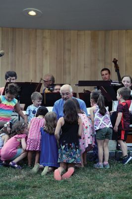 Young People’s Concert
The Marion Concert Band catered to the young ones on July 27 during its children’s-themed performance, “Young People’s Concert,” with selected songs familiar to children. Here, band conductor Tobias Monte sits onstage with the children, firing up their imaginations, and handing out instruments for the children to experiment with. Photos by Jean Perry
