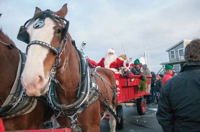 Marion Village Stroll 
The Marion Village Stroll on Sunday includes a visit from Santa who arrived by boat and then was transported by wagon to meet the children. Photo by Felix Perez
