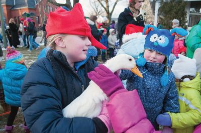 Marion Village Stroll 
The Marion Village Stroll on Sunday includes a visit from Santa who arrived by boat and then was transported by wagon to meet the children. Photo by Felix Perez
