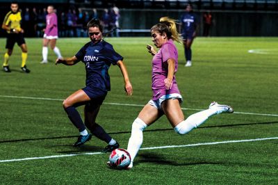 Rochester native Meg Hughes is seen in October 21 action for the Providence College women’s soccer team against Connecticut. Hughes has battled back from a serious knee injury to become one of the Big East Conference’s top offensive players. Photo by Ryan Feeney
