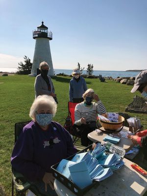 Mattapoisett Women’s Club 
The Mattapoisett Women’s Club was on hand October 24 in the sun at Ned’s Point selling daffodil bulbs, cloth bags commemorating 100 years of women’s right to vote, and individual notecards and postcards. Photo by Jennifer Shepley
